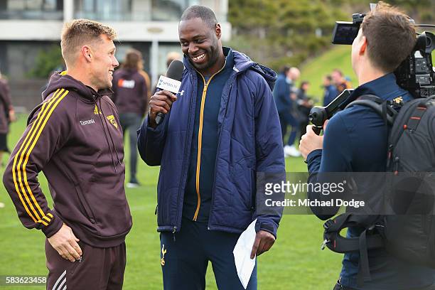 Retired Spurs captain Ledley King interviews Sam Mitchell of the Hawks for Spurs TV during a Tottenham Hotspur player visit to the Hawthorn Hawks AFL...