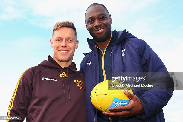 Retired Spurs captain Ledley King poses with Sam Mitchell of the Hawks during a Tottenham Hotspur player visit to the Hawthorn Hawks AFL team at...