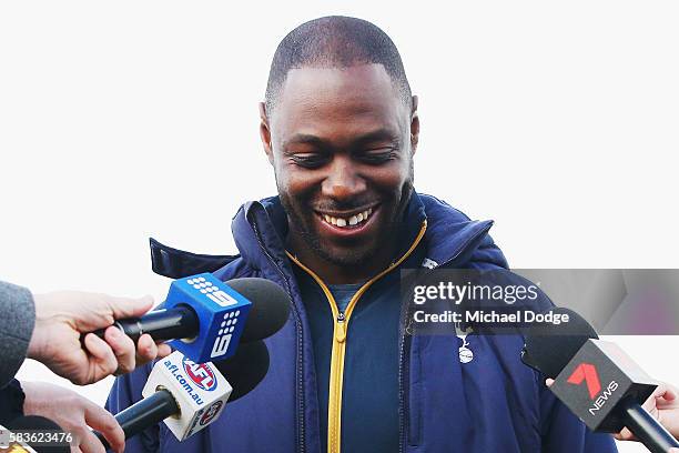Retired Spurs captain Ledley King reacts when speaking to media during a Tottenham Hotspur player visit to the Hawthorn Hawks AFL team at Waverley...