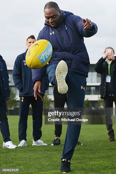 Retired Spurs captain Ledley King kicks an AFL Football during a Tottenham Hotspur player visit to the Hawthorn Hawks AFL team at Waverley Park on...