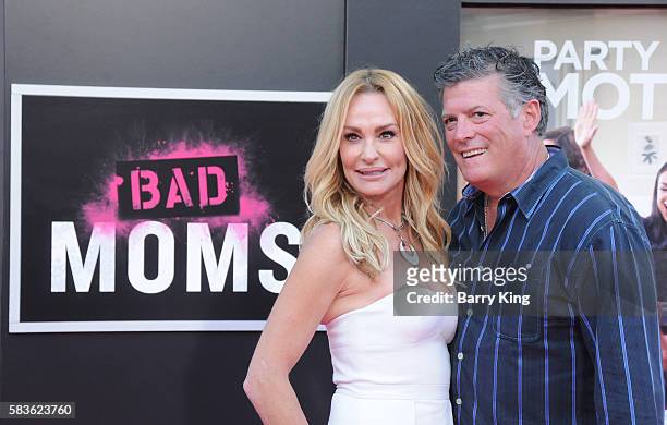 Personality Taylor Armstrong and husband John Bluher attend the premiere of STX Entertainment's' 'Bad Moms' at Mann Village Theatre on July 26, 2016...