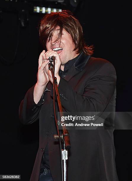 Robbie Fowler ambassador of Liverpool sings with The Beatles cover band during a visit to a supporters club on July 26, 2016 in Los Angeles,...