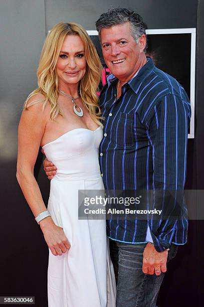 Personality Taylor Armstrong and John Bluher attend the Premiere of STX Entertainment's "Bad Moms" at Mann Village Theatre on July 26, 2016 in...