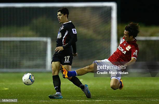 Lewis Beumie of Blacktown is tackled by Yutaro Sin of Sydney United 58 FC during the FFA Cup round of 32 match between Blacktown City and Sydney...