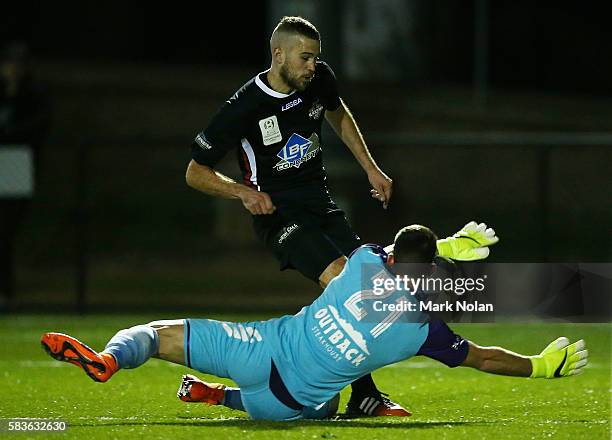 Thomas Manos of Sydney United 58 FC blocks a shot by Sasa Macura of Blacktown during the FFA Cup round of 32 match between Blacktown City and Sydney...