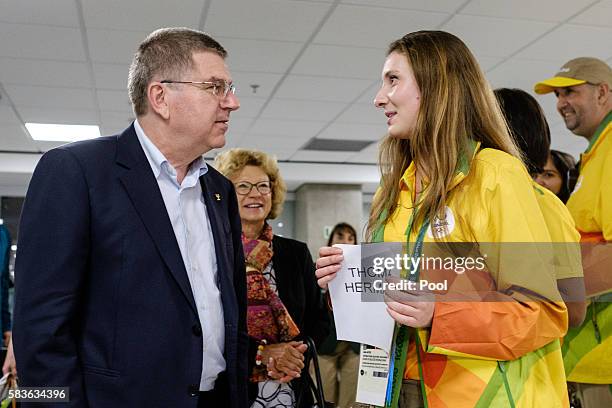 President of the International Olympic Committee Thomas Bach is welcomed by volunteers on his arrival for Rio 2016 Olympic games at Antonio Carlos...