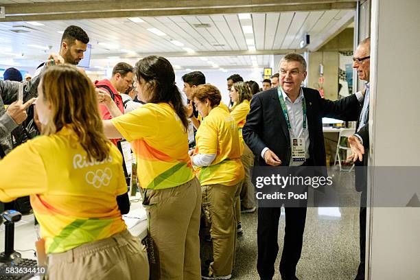 President of the International Olympic Committee Tomas Bach is seen at the credential counter on his arrival for Rio 2016 Olympic games at Antonio...