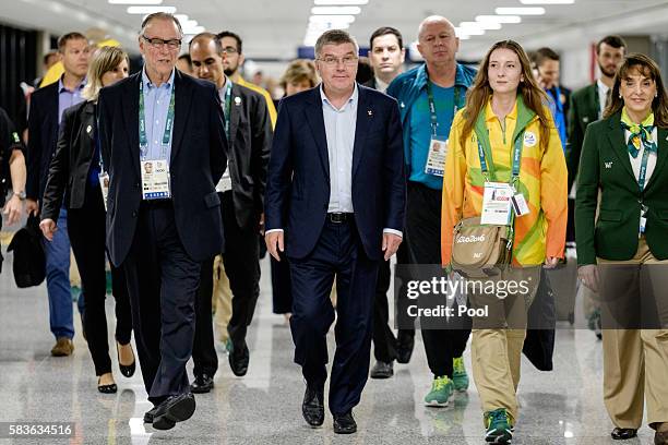 President of the International Olympic Committee Tomas Bach walks with Carlos Nuzman , President of the Brazilian Olympic Committee on his arrival...