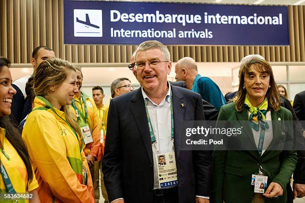 President of the International Olympic Committee Tomas Bach is welcomed by volunteers on his arrival for Rio 2016 Olympic Games at Antonio Carlos...