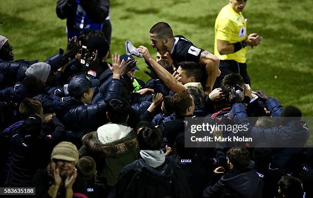 Patrick Antelmi of Blacktown celebrates scoring a goal with team mates and fans during the FFA Cup round of 32 match between Blacktown City and...