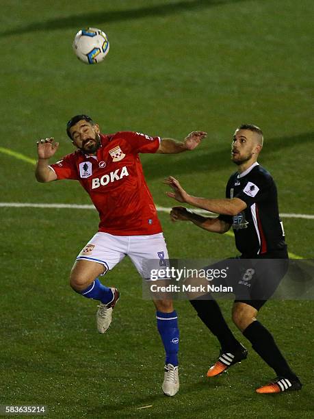 Peter Triantis of Sydney United 58 FC and Sasa Macura of Blacktown contest possession during the FFA Cup round of 32 match between Blacktown City and...