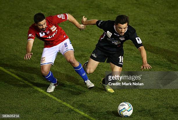 Peter Triantis of Sydney United 58 FC and Connor Evans of Blacktown contest possession during the FFA Cup round of 32 match between Blacktown City...
