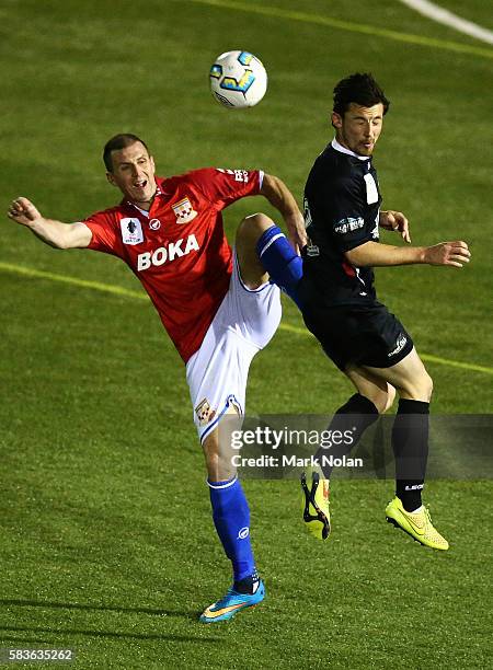 Eddy Bosnar of Sydney United 58 FC and Patrick Antelmi of Blacktown contest possession during the FFA Cup round of 32 match between Blacktown City...