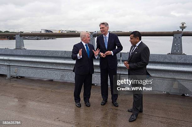 Declan Collier CEO of London City Airport, Chancellor Phillip Hammond and Minister for Aviation Lord Ahmad during a visit to London City Airport on...