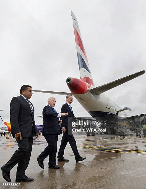 Minister for Aviation Lord Ahmad, Declan Collier CEO of London City Airport and Chancellor Phillip Hammond during a visit to London City Airport on...