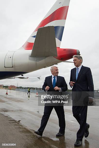 Declan Collier CEO of London City Airport and Chancellor Phillip Hammond during a visit to London City Airport on July 27, 2016 in Lodnon, England....