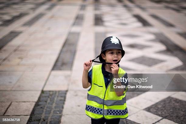 Young boy dressed as a policeman plays in Guilhall Yard during an opening day celebrating 175 years of policing on July 27, 2016 in London, England....