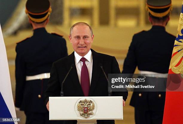 Russian President Vladimir Putin speaks during a meeting with the Russian national Olympic team, including those prohibited to participate Rio 2016...