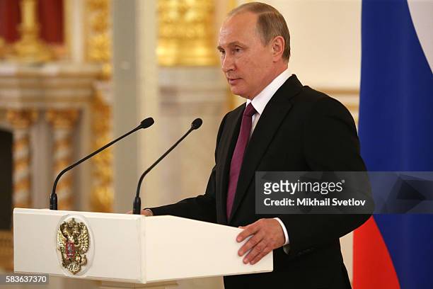 Russian President Vladimir Putin speaks during a meeting with the Russian national Olympic team, including those prohibited to participate Rio 2016...