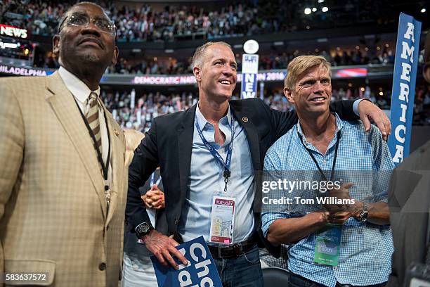 Rep. Sean Patrick Maloney, D-N.Y., center, and his husband, Randy Florke, talk with Rep. Gregory Meeks, D-N.Y., left, on the floor of the Wells Fargo...