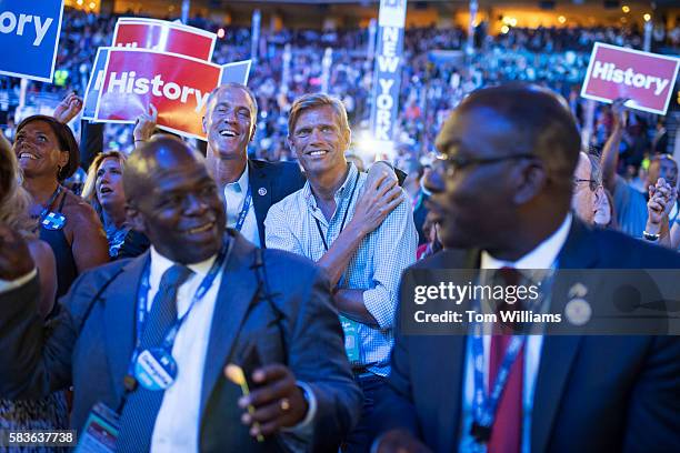 Rep. Sean Patrick Maloney, D-N.Y., and his husband, Randy Florke, back right, dance on the floor of the Wells Fargo Center in Philadelphia, Pa., on...