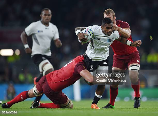 Nikola Matawalu of Fiji is tackled by Geoff Parling and Chris Robshaw of England during the Rugby World Cup 2015 Group A match between England and...