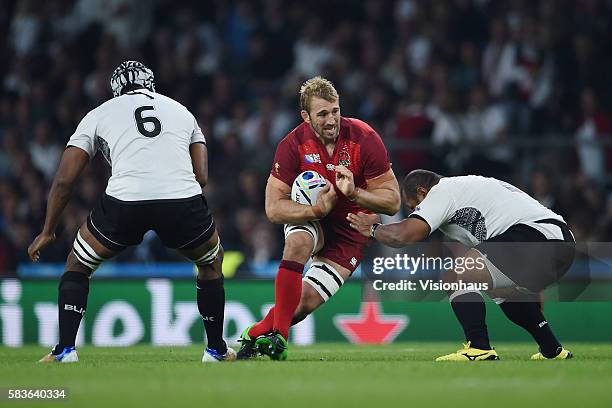 Chris Robshaw of England runs at the Fiji defence during the Rugby World Cup 2015 Group A match between England and Fiji at Twickenham Stadium in...