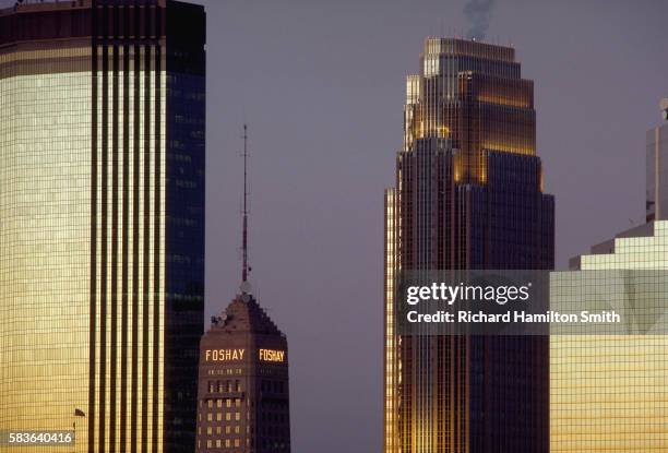 foshay tower among taller skyscrapers - minneapolis stock pictures, royalty-free photos & images