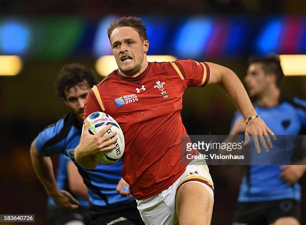 Cory Allen of Wales runs through to score a try during the Rugby World Cup pool A group match between Wales and Uruguay at the Millennium Stadium in...