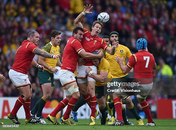 Liam Williams of Wales offloads the ball to Justin Tipuric during the Rugby World Cup 2015 Group A match between Australia and Wales at Twickenham...
