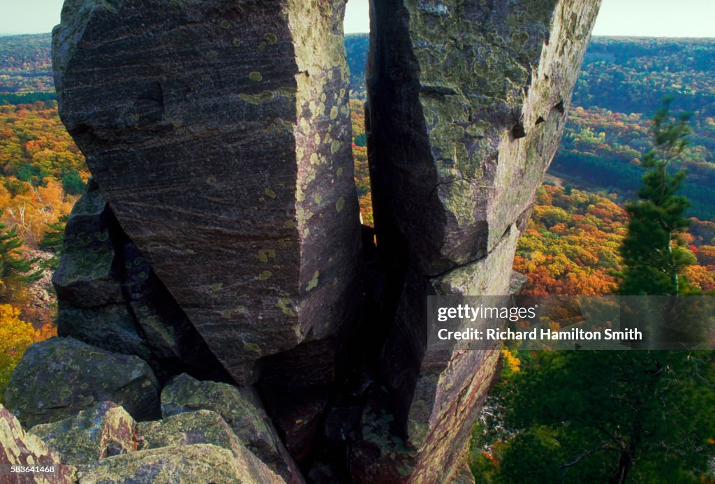 Rock Formation With Autumn Valley Beyond