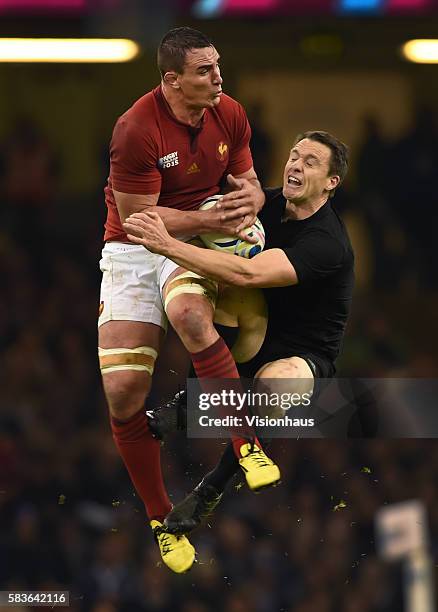 Ben Smith of New Zealand challenges for a high ball with Louis Picamoles of France during the Rugby World Cup quarter final match between New Zealand...