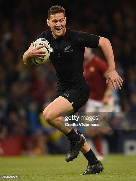 Tawera Kerr-Barlow of New Zealand runs through to score a try during the Rugby World Cup quarter final match between New Zealand and France at the...