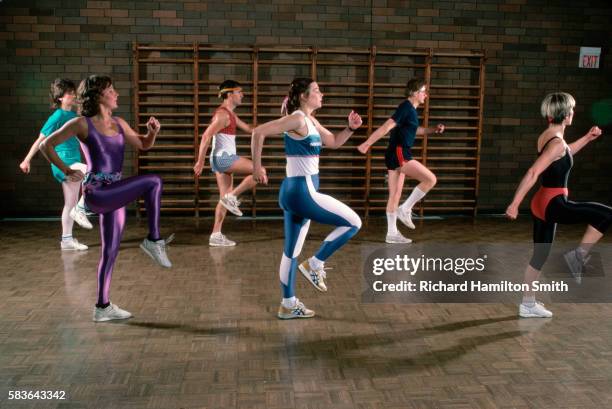 group doing low impact aerobics - aerobic stock pictures, royalty-free photos & images