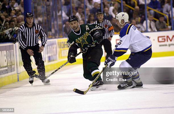 Sergei Zubov of the Dallas Stars battles with Alexei Gusarov of the St. Louis Blues during game 3 of Western Conference Semifinals at the Savvis...