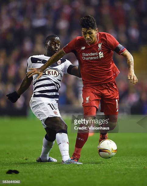 Roberto Firmino of Liverpool and Henri Salvet of Bordeaux in action during the UEFA Europa League Group match between Liverpool and FC Girondins de...