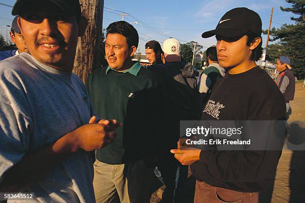 Farmingville, Long Island, New York: Mexican immigrant day laborers waiting for jobs.