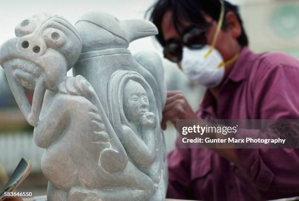 native eskimo soapstone carver, canadian northwest territories - soapstone carving stock pictures, royalty-free photos & images