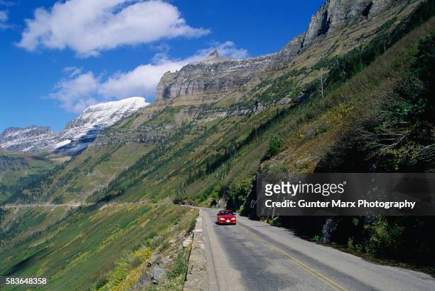 car driving by glacier - going to the sun road stock pictures, royalty-free photos & images