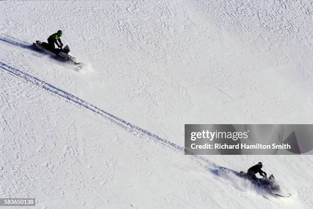 snowmobiling in togwotee pass - snowmobiling stock pictures, royalty-free photos & images