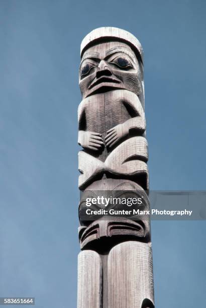 carved human figure on haida totem pole, canada - haida totem stock pictures, royalty-free photos & images