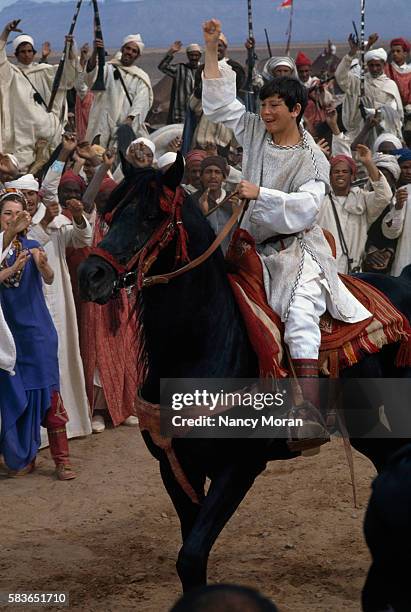 American actor Kelly Reno on the set of The Black Stallion Returns, directed by Robert Dalva.