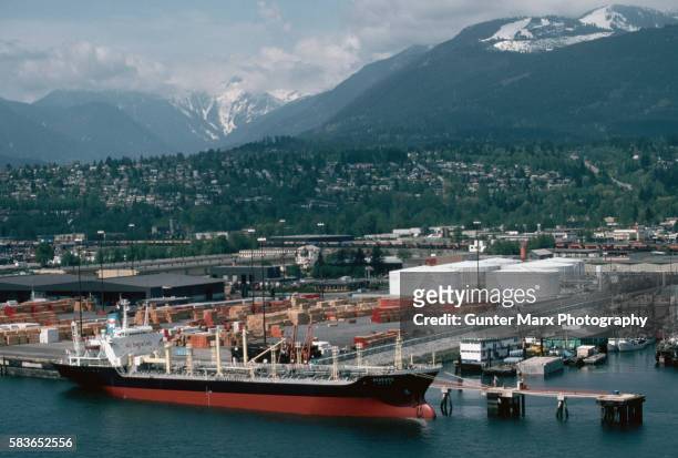 cargo ship at vancouver wharves - vancouver harbour stock pictures, royalty-free photos & images