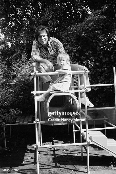 American-born British director, writer, and memeber of the comedy group Monty Python, Terry Gilliam with his second daughter Holly, 2.