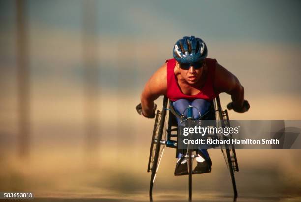 wheelchair cyclist in training - wheelchair race stock pictures, royalty-free photos & images