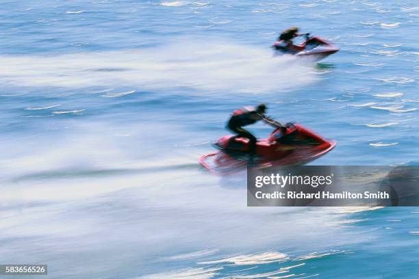 people racing jet skis - jet ski stock pictures, royalty-free photos & images