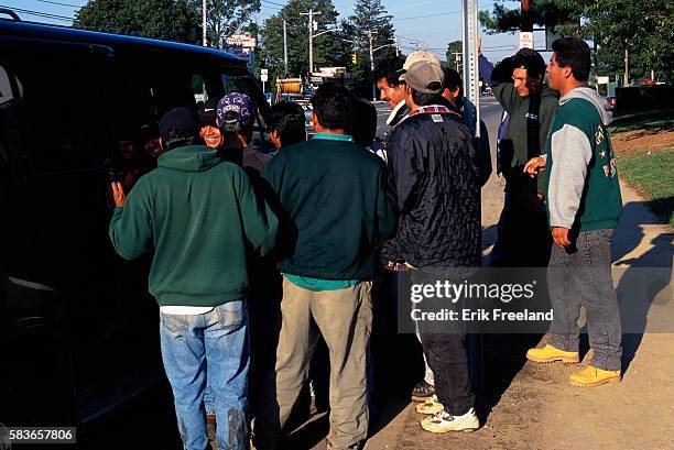 Farmingville, Long Island, New York: Mexican immigrant day laborers waiting for jobs.