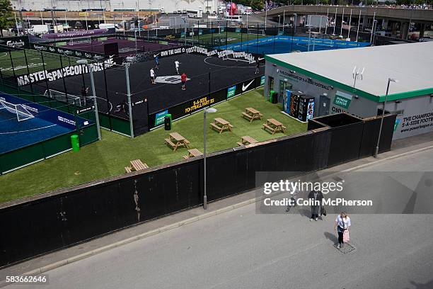 Three Swansea fans walking towards the stadium on the day of the Npower Championship play-off final between Reading and Swansea City at Wembley...