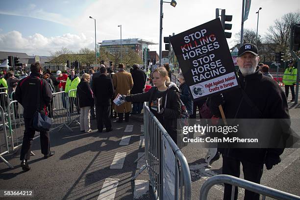 Woman protestor handing out leaflets about animal cruelty to racegoers outside Aintree racecourse on the day of the Grand National meeting. Tens of...