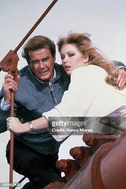 British actor Roger Moore and American actress Tanya Roberts on the set of the James Bond 007 film A View to a Kill, directed by John Glen.